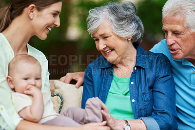 Buy stock photo Cropped shot of a three generational family spending time outdoors