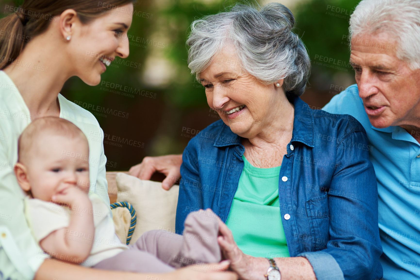 Buy stock photo Cropped shot of a three generational family spending time outdoors