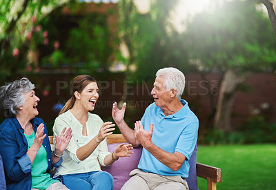 Buy stock photo Shot of a senior couple spending time with their daughter