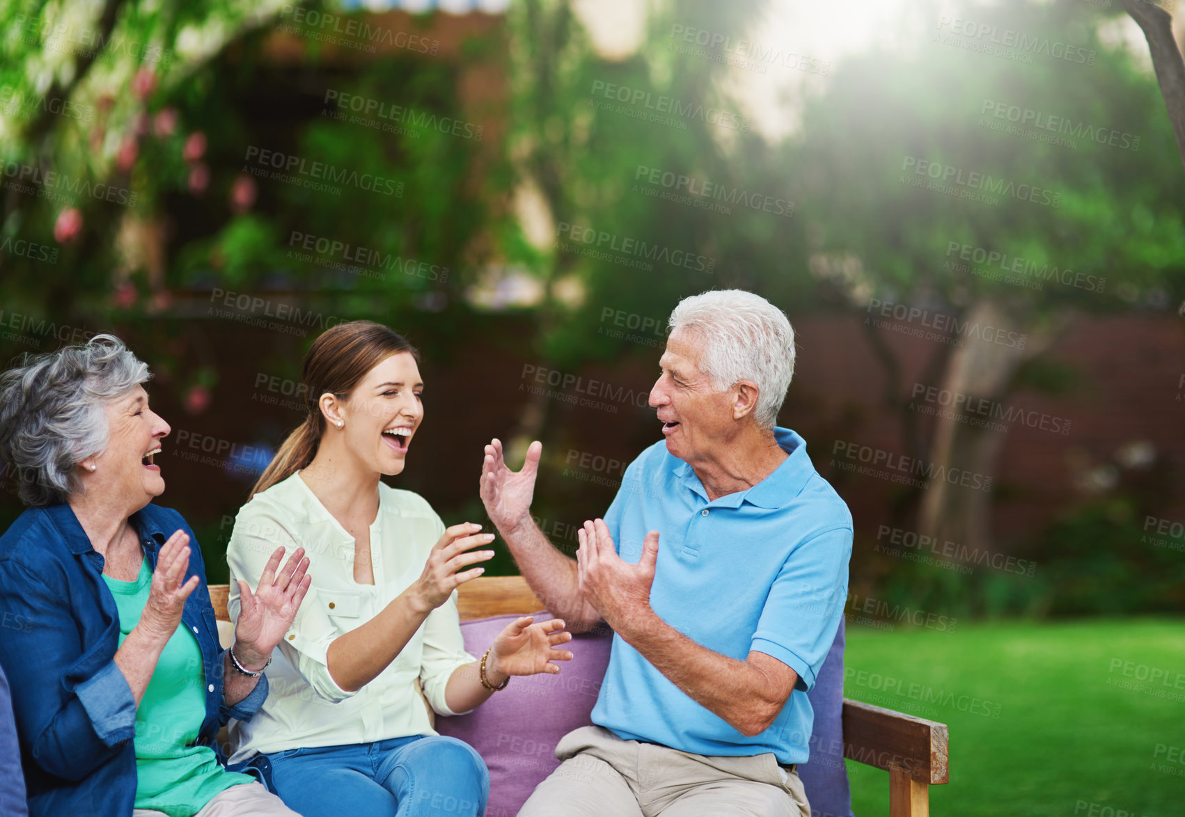 Buy stock photo Shot of a senior couple spending time with their daughter