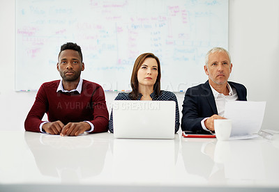 Buy stock photo Cropped shot of a group of business colleagues sitting in on a presentation