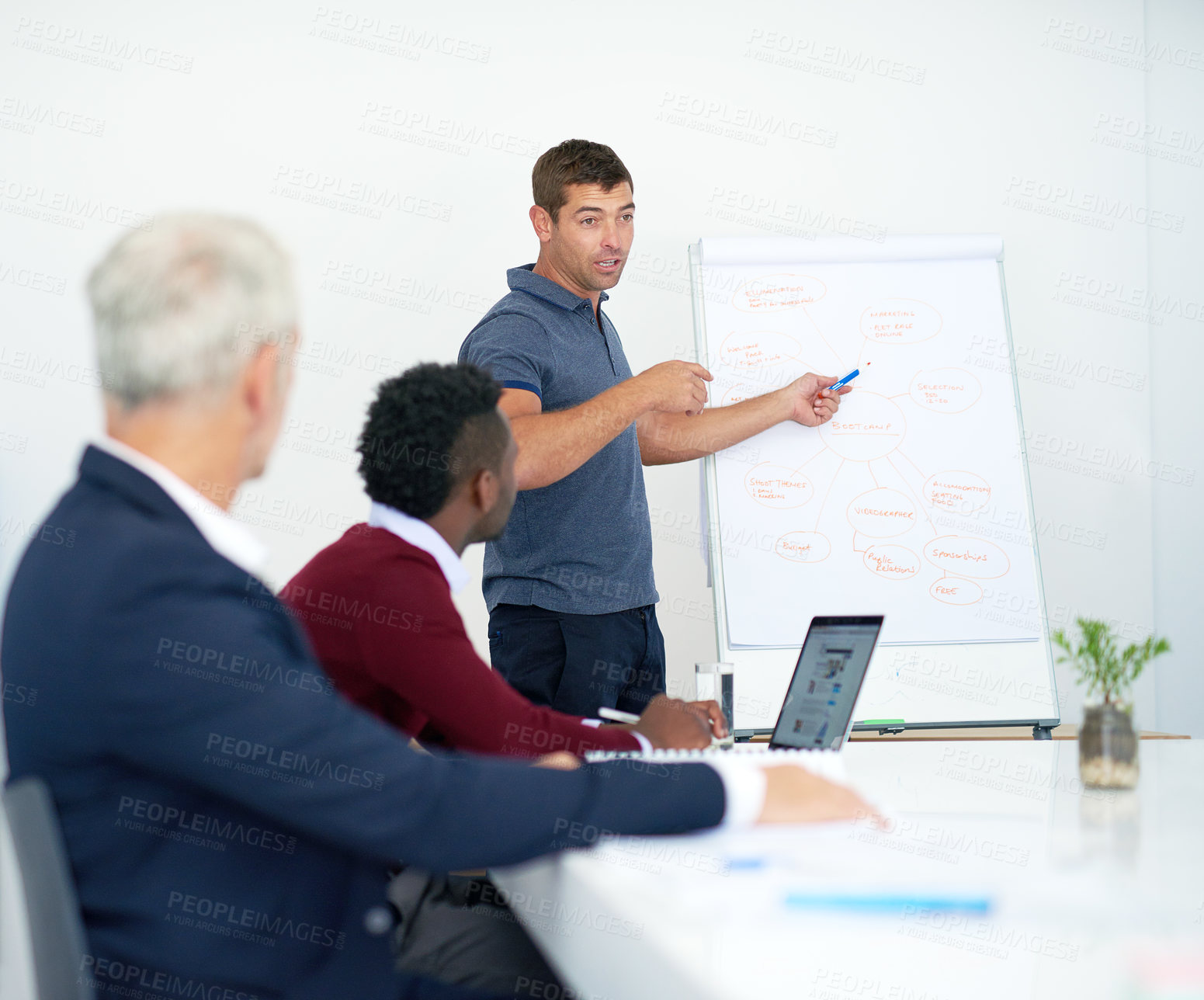 Buy stock photo Creative, team and man at whiteboard with presentation for planning videography project or content creation. Small business, employees and people in boardroom with brainstorming, production and ideas