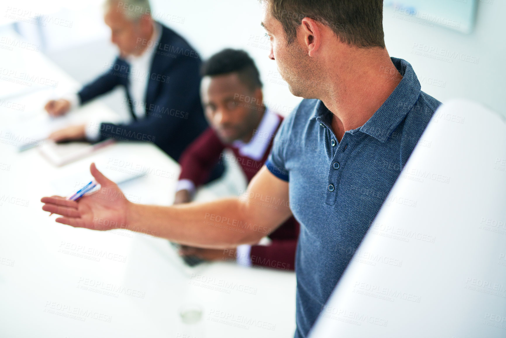 Buy stock photo Cropped shot of a young businessman giving a presentation in the boardroom