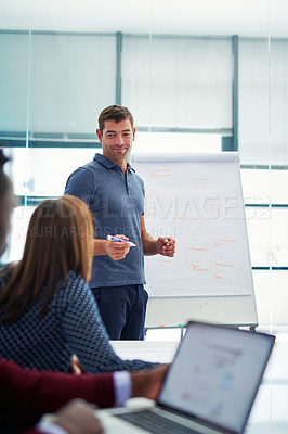 Buy stock photo Cropped shot of a young businessman giving a presentation in the boardroom