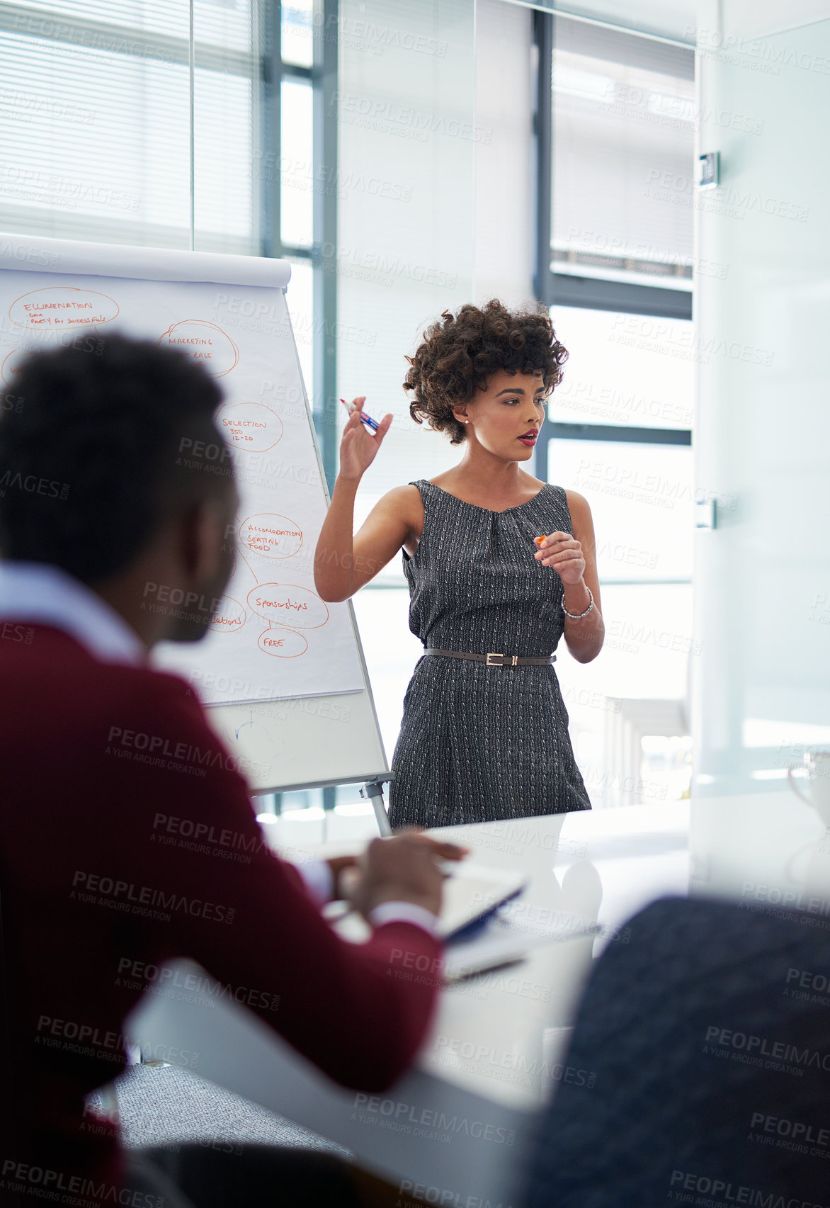 Buy stock photo Cropped shot of a young businesswoman giving a presentation in the boardroom