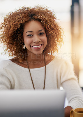 Buy stock photo Portrait of a young businesswoman sitting at her laptop in an office
