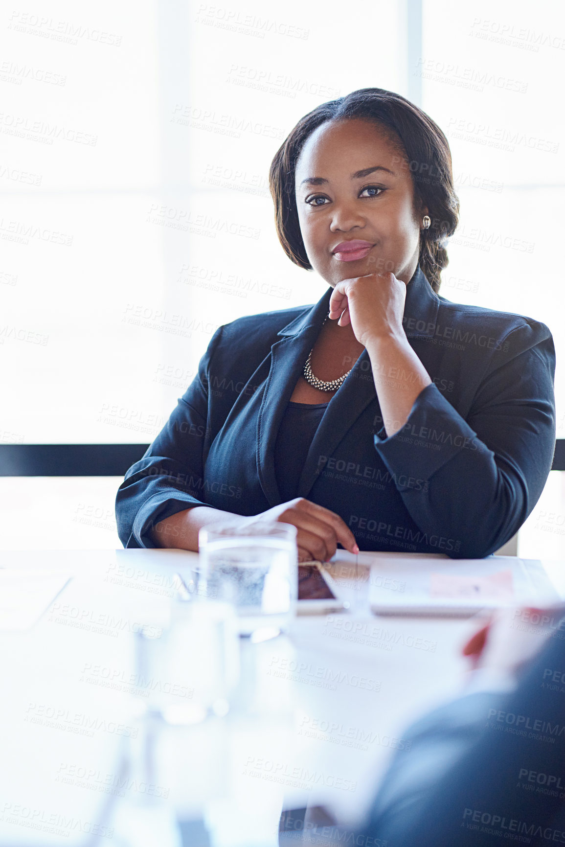 Buy stock photo Shot of a businesswoman sitting in an office