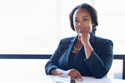 Buy stock photo Shot of a businesswoman sitting in an office