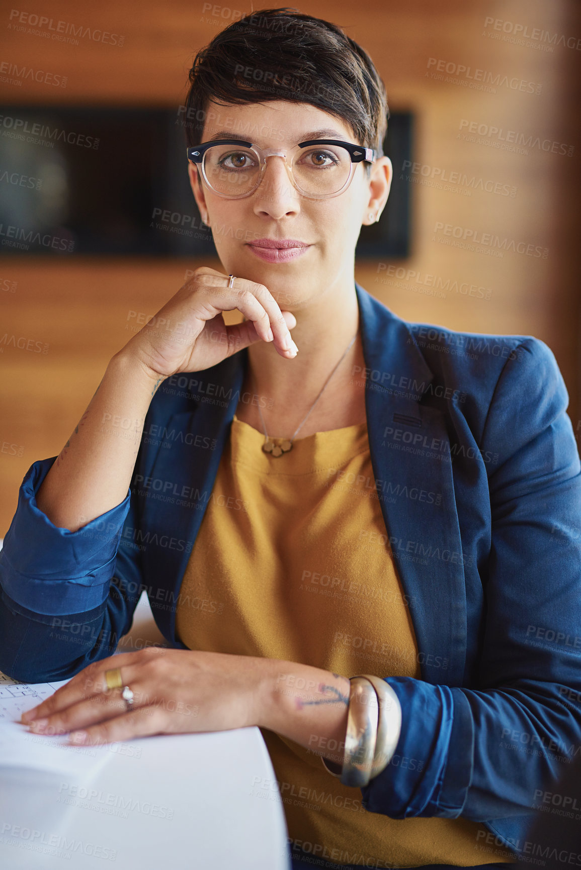 Buy stock photo Cropped portrait of a businesswoman sitting in the boardroom