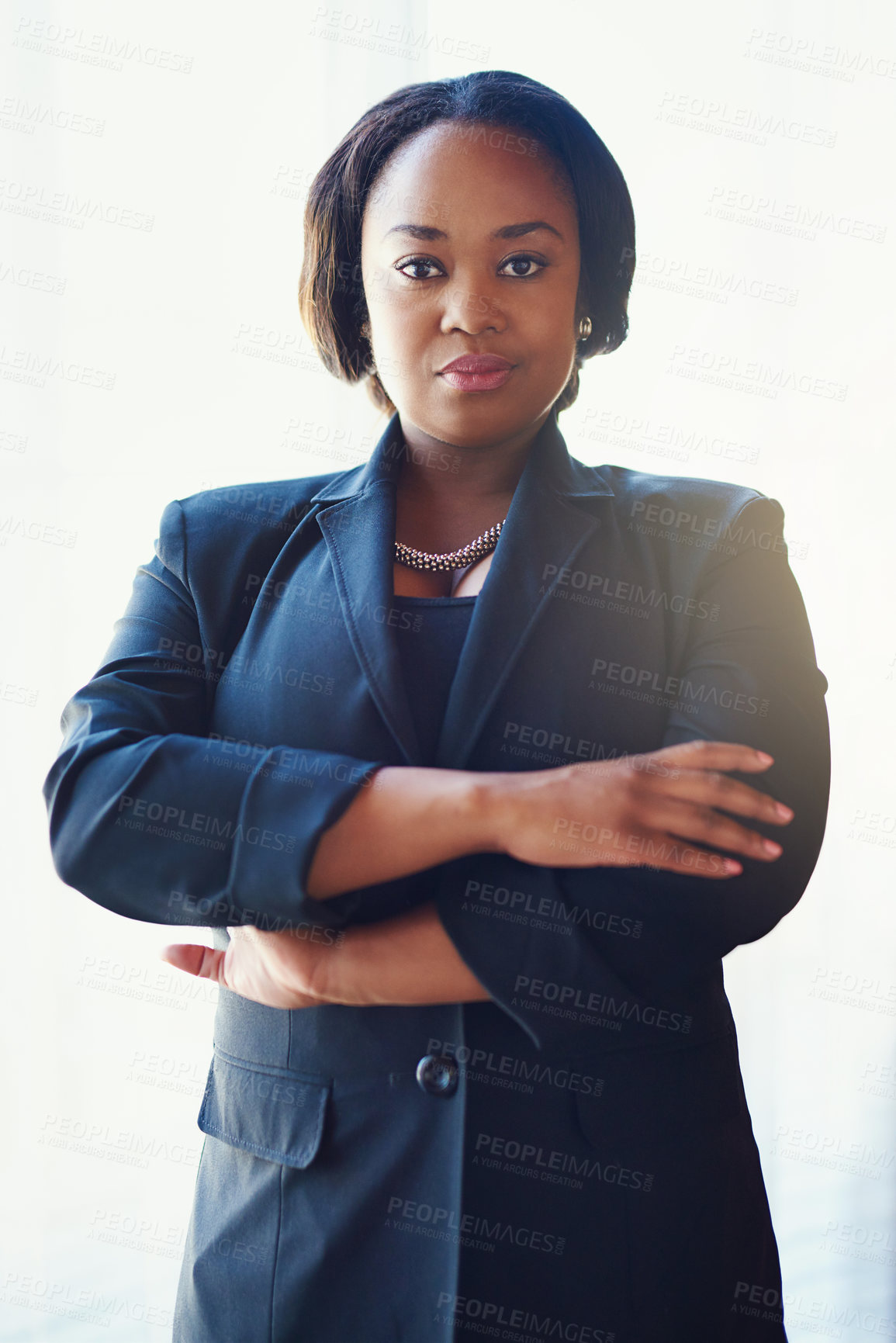 Buy stock photo Portrait of a confident businesswoman standing in her office