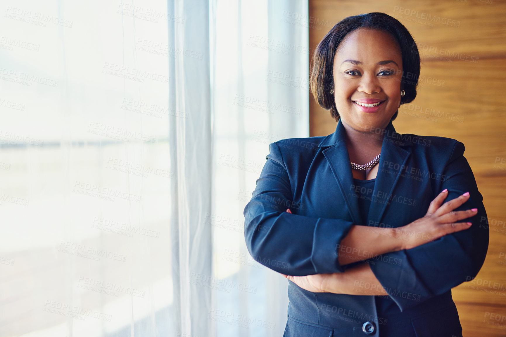 Buy stock photo Portrait of a confident businesswoman standing in her office