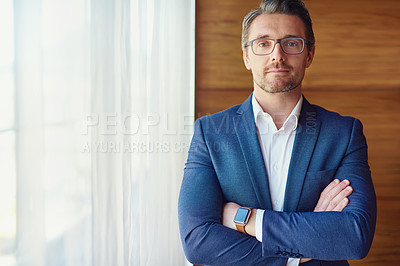Buy stock photo Cropped shot of a confident businessman standing in his office