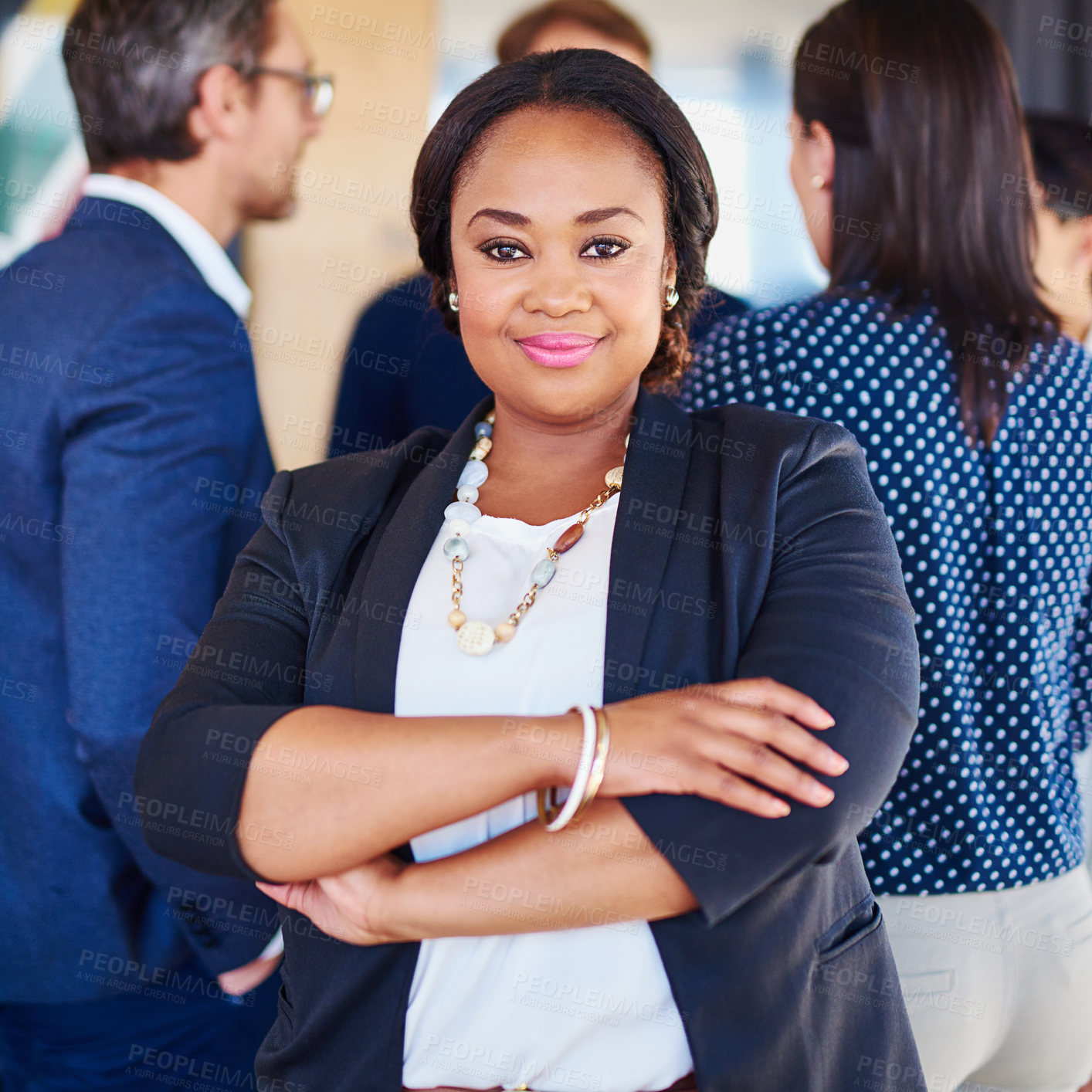 Buy stock photo Cropped portrait of a businesswoman standing in the office with her colleagues in the background