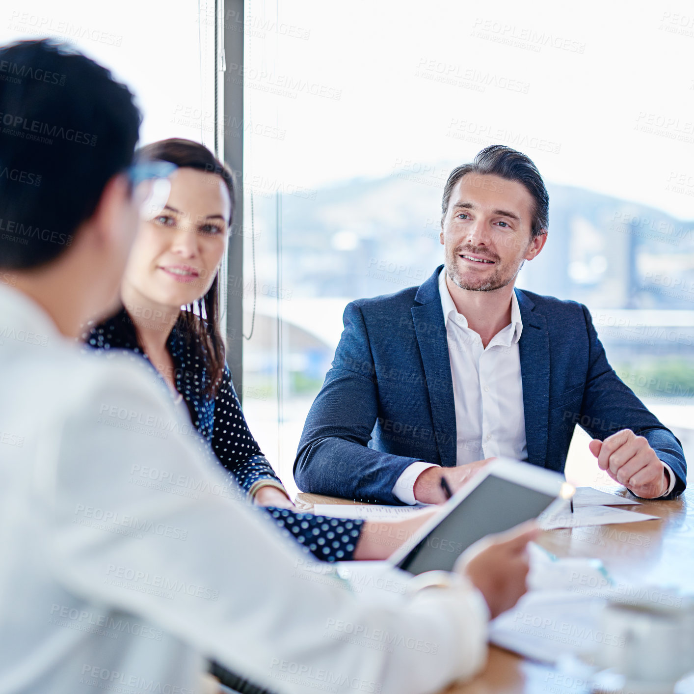 Buy stock photo Cropped shot of corporate businesspeople meeting in the boardroom