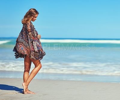 Buy stock photo Shot of a thoughtful young woman at the beach