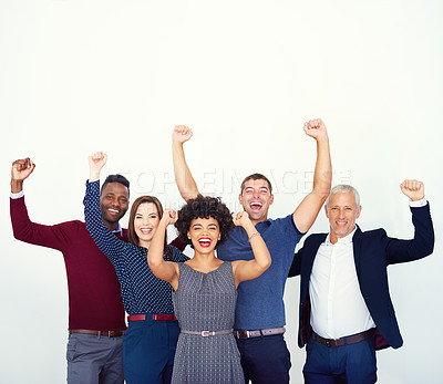 Buy stock photo Studio portrait of a group of businesspeople raising their hands in celebration