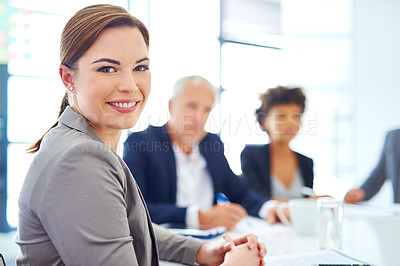 Buy stock photo Cropped portrait of a young businesswoman sitting in a meeting