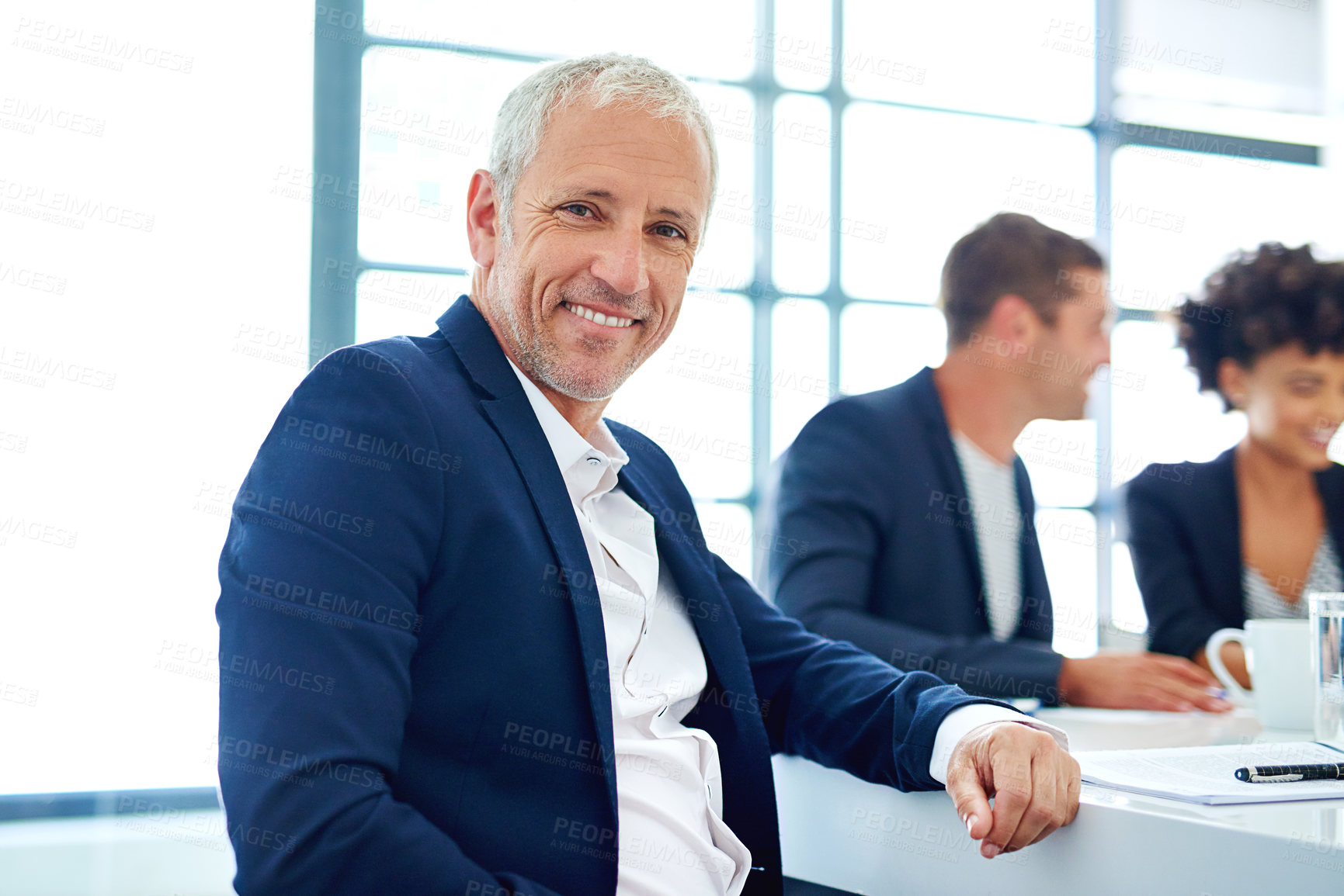 Buy stock photo Mature man, office and smile in meeting on portrait in confidence for planning and brainstorming. Male person, employee and happy with pride at boardroom for teamwork or collaboration on strategy