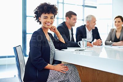 Buy stock photo Cropped portrait of a young businesswoman sitting in a meeting