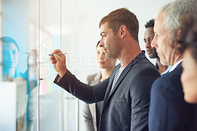 Buy stock photo Glass wall, business people and brainstorming with cooperation, writing and meeting for calendar. Group, employees and staff with ideas, session and productivity with schedule or planning for project