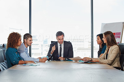 Buy stock photo Shot of a group of businesspeople in a meeting