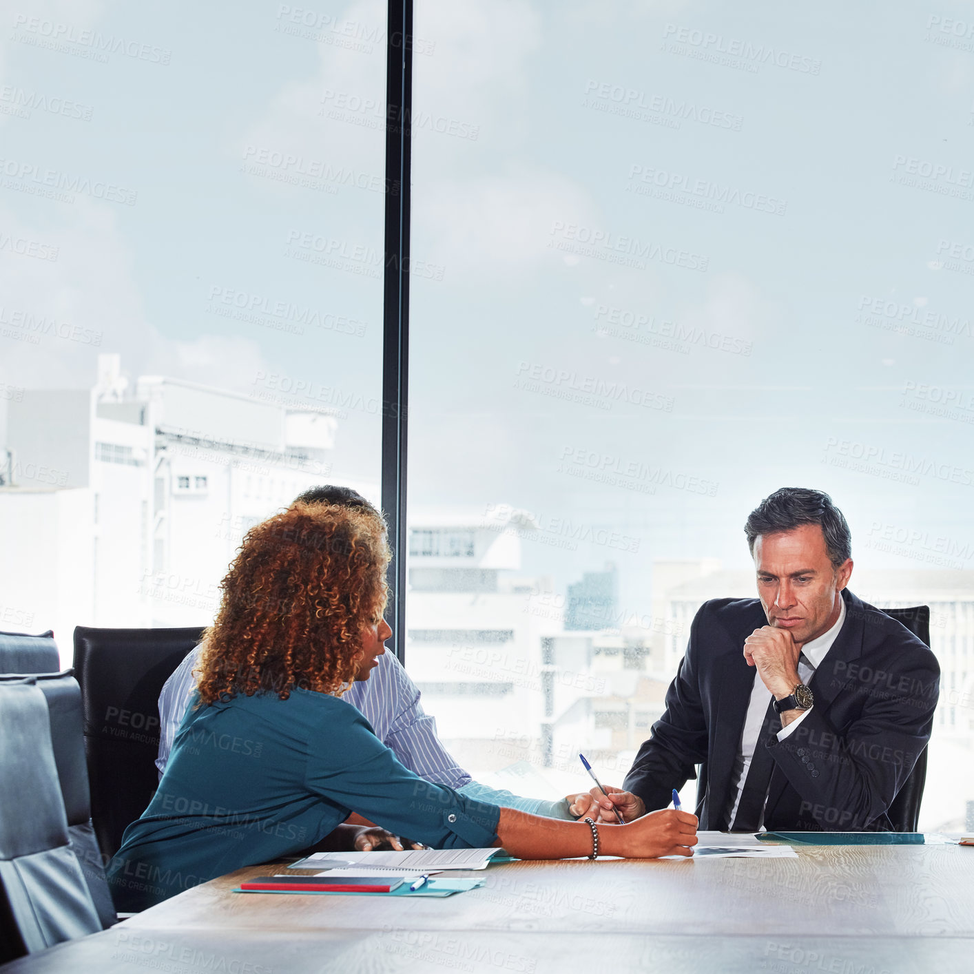 Buy stock photo Shot of a group of businesspeople in a meeting