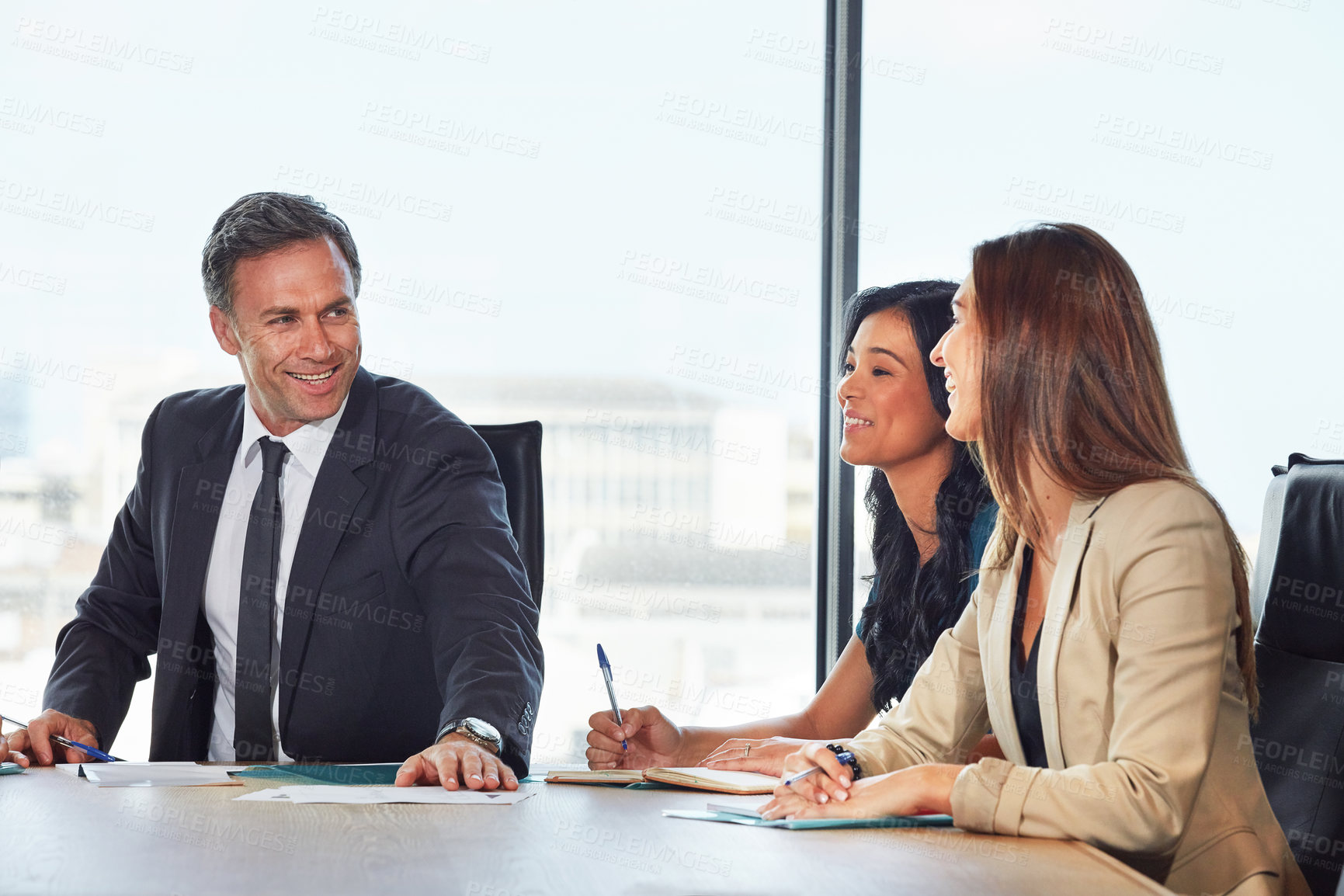 Buy stock photo Shot of a group of businesspeople in a meeting