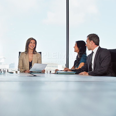 Buy stock photo Shot of a group of businesspeople in a meeting