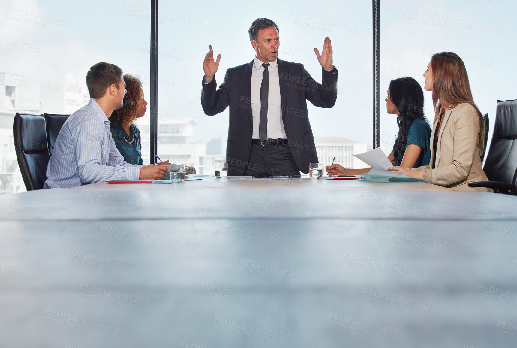 Buy stock photo Shot of a group of businesspeople in a meeting