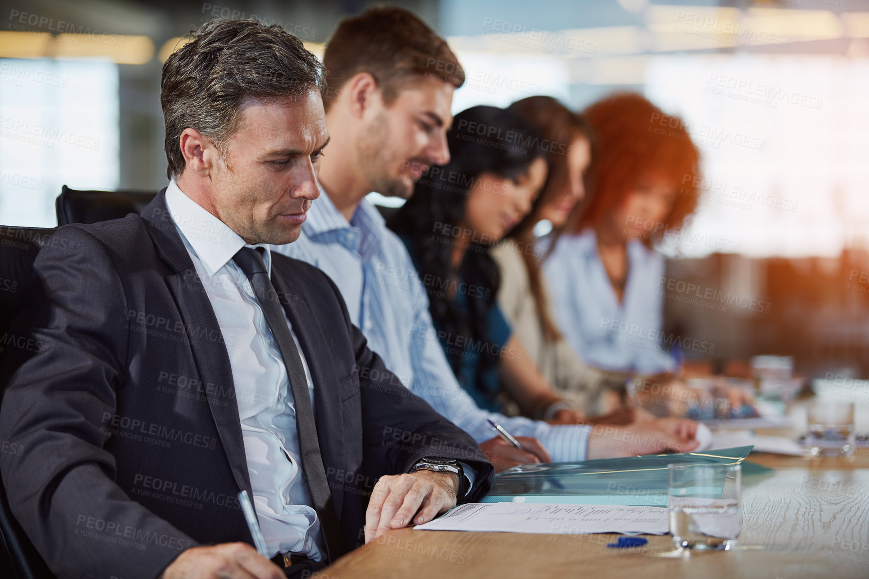 Buy stock photo Cropped shot of businesspeople in the boardroom