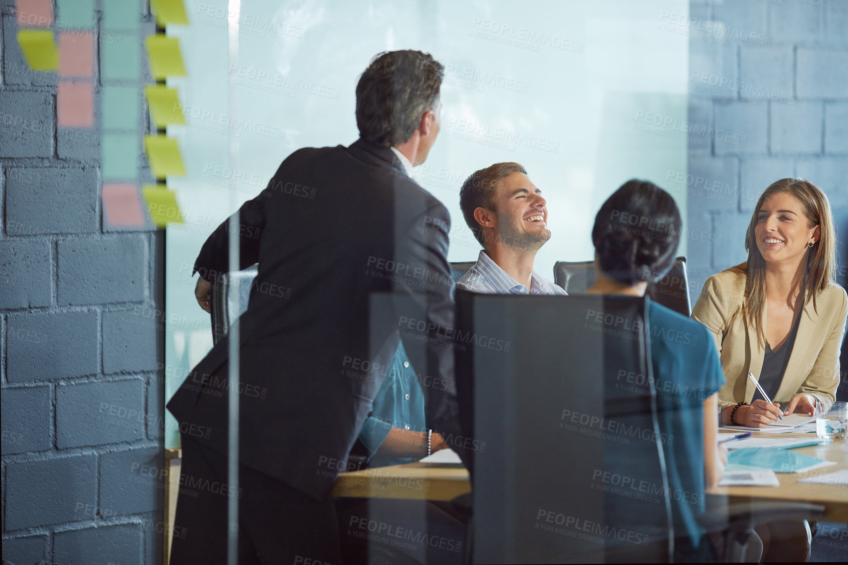 Buy stock photo Shot of a team of colleagues having a meeting in an office