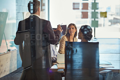 Buy stock photo Shot of a team of colleagues having a meeting in an office