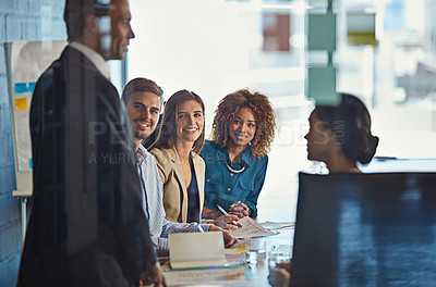 Buy stock photo Shot of a team of colleagues having a meeting in an office