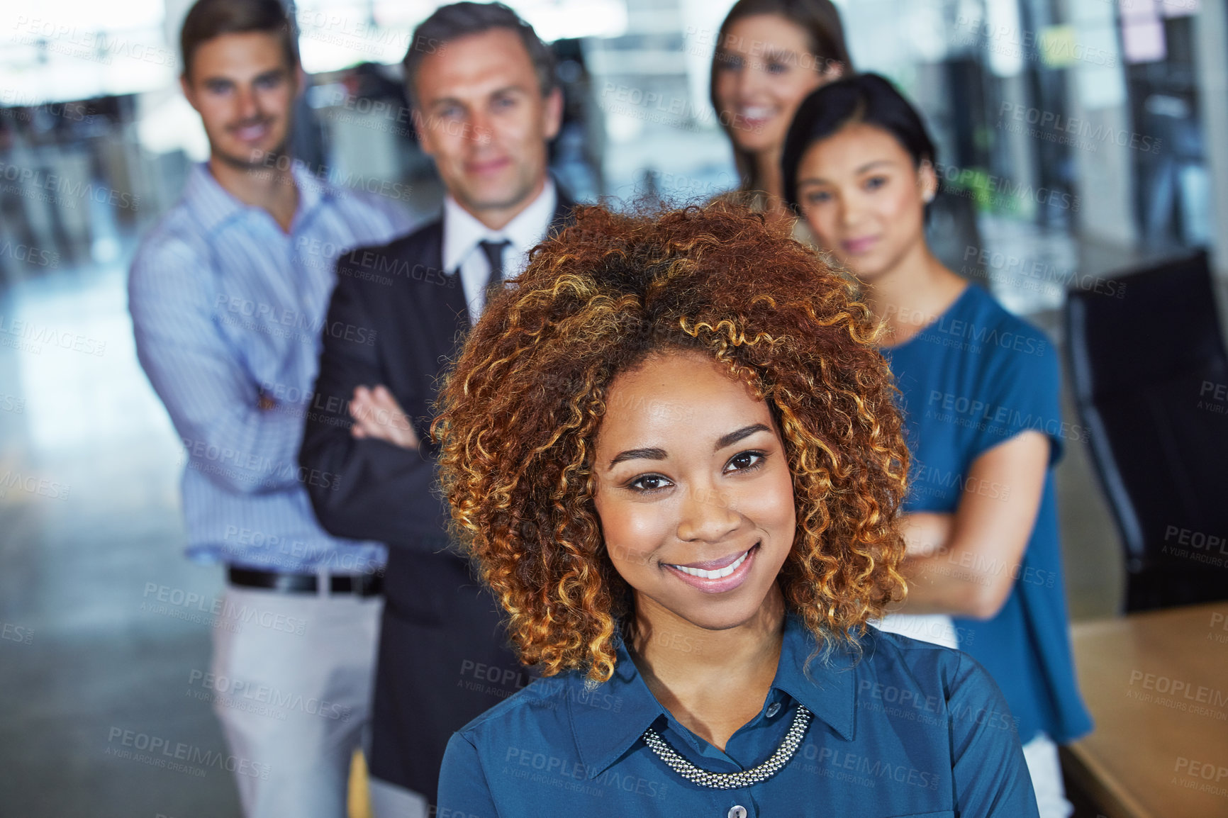 Buy stock photo Portrait of a team of professionals standing together in an office