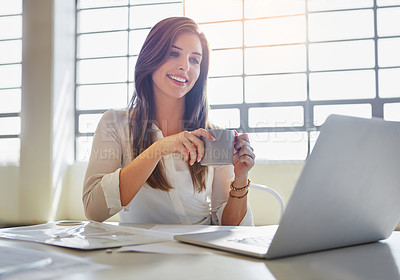 Buy stock photo Shot of a businesswoman using a laptop in an office