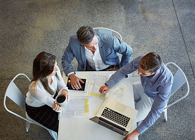 Buy stock photo Top view, business and employees with planning, teamwork and collaboration in the workplace. Staff, group and coworkers with a laptop, brainstorming and share ideas with conversation and development
