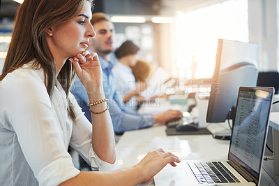 Buy stock photo Cropped shot of a group of businesspeople working in the office