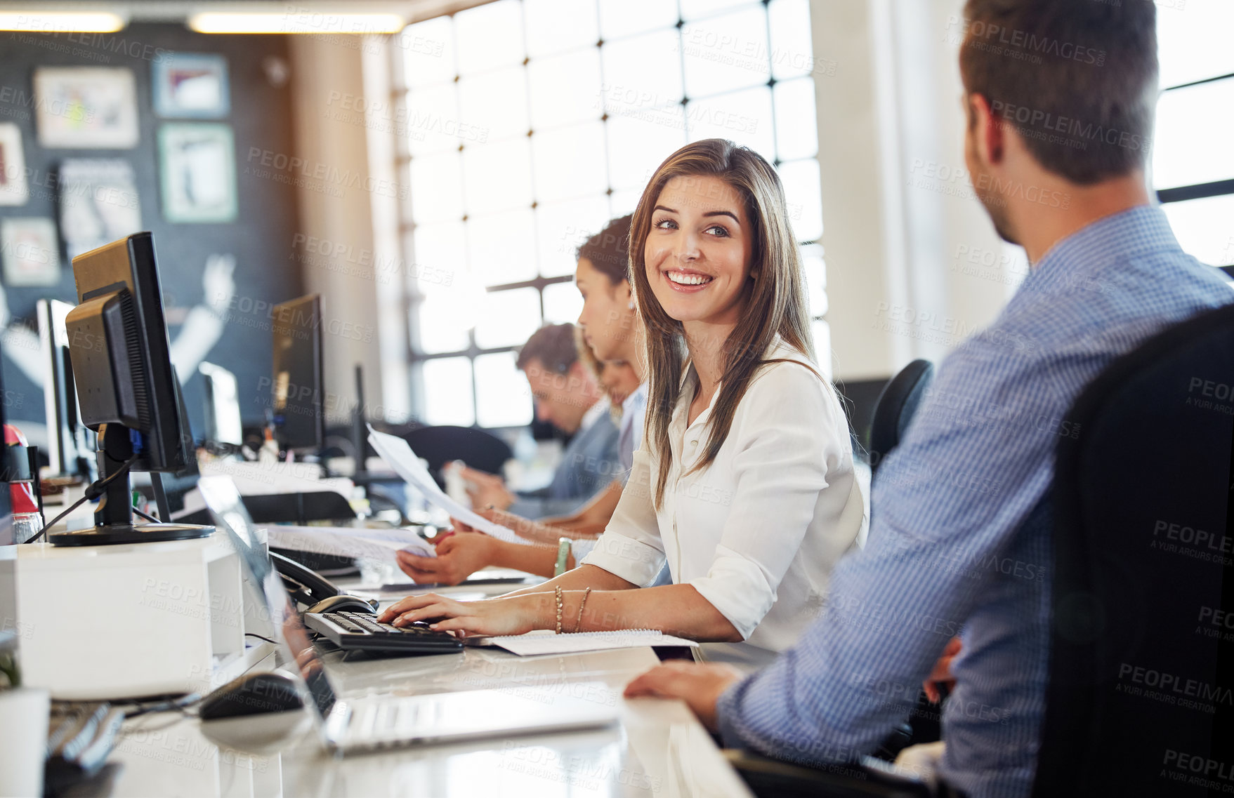 Buy stock photo Cropped shot of a group of businesspeople working in the office