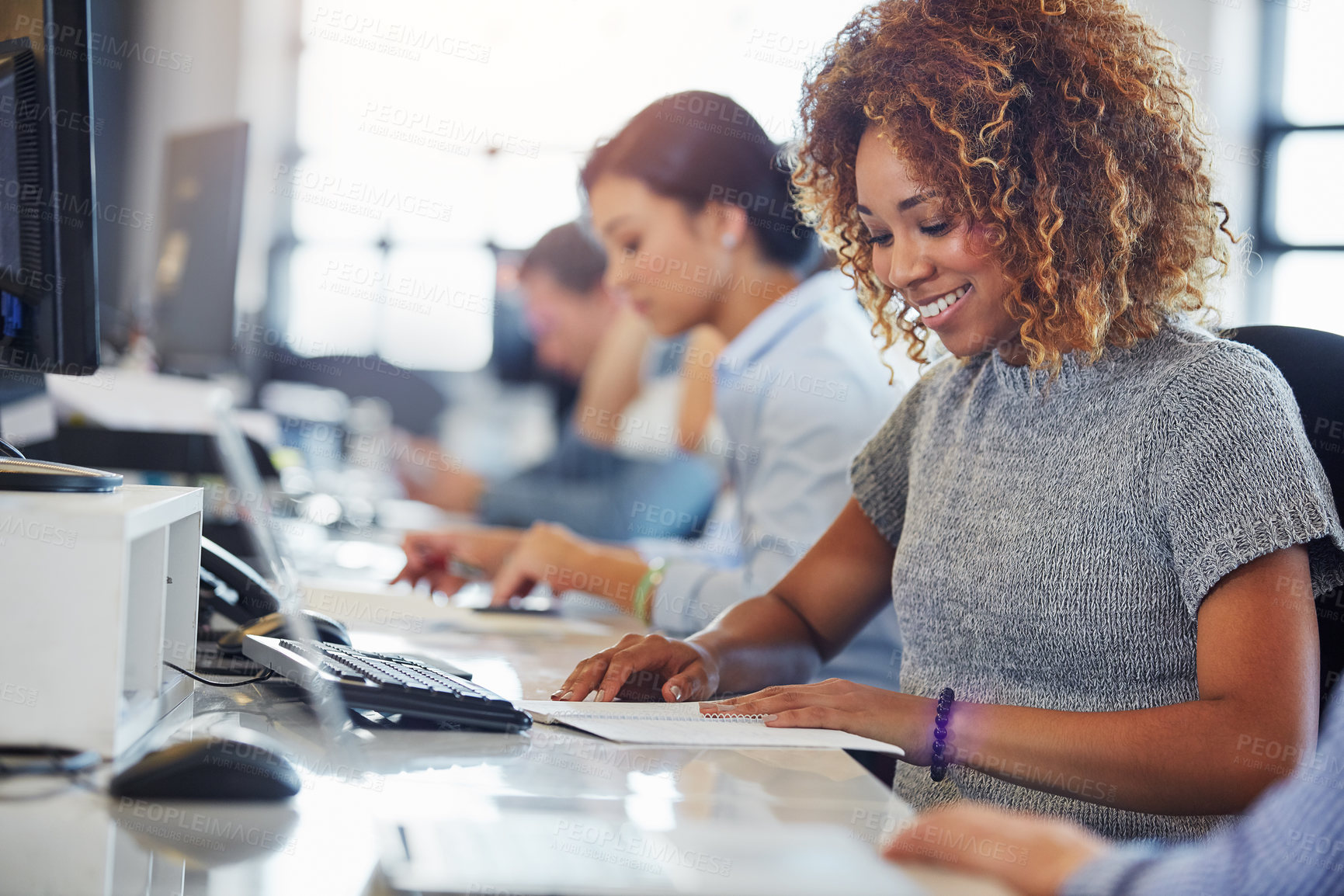 Buy stock photo Cropped shot of a group of businesspeople working in the office