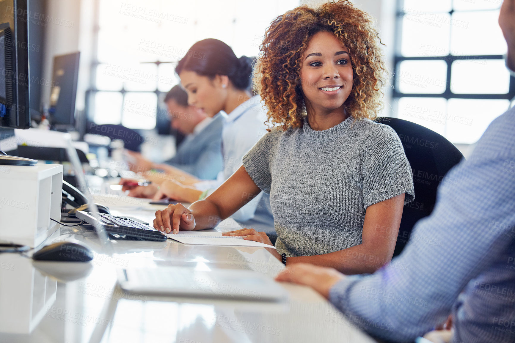 Buy stock photo Cropped shot of a group of businesspeople working in the office