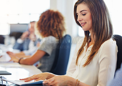 Buy stock photo Cropped shot of a group of businesspeople working in the office
