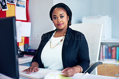 Buy stock photo Portrait of a young businesswoman working at her desk