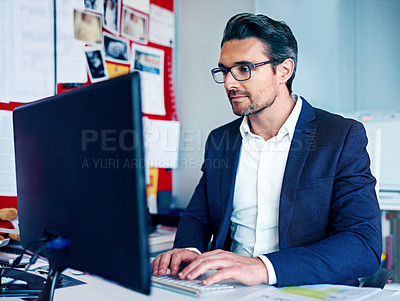 Buy stock photo Shot of a businessman working at his desk