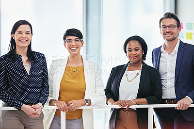 Buy stock photo Cropped portrait of four business colleagues standing in the office