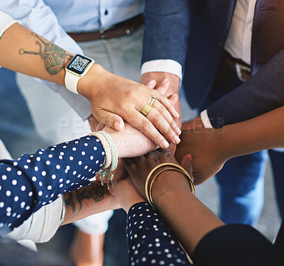 Buy stock photo High angle shot of a group of coworkers' hands in a huddle