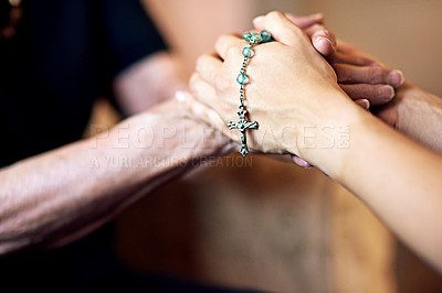 Buy stock photo Cropped shot of a person compassionately holding a rosary and an elderly woman’s hands