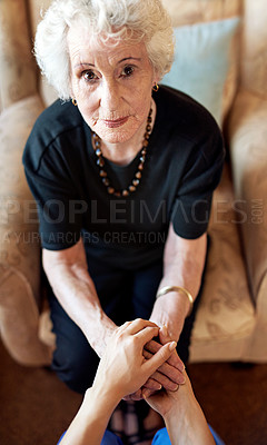 Buy stock photo Cropped shot of a person holding an elderly woman’s hands