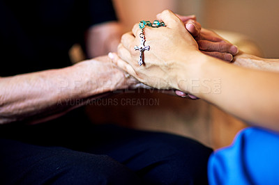 Buy stock photo Cropped shot of a person compassionately holding a rosary and an elderly woman’s hands