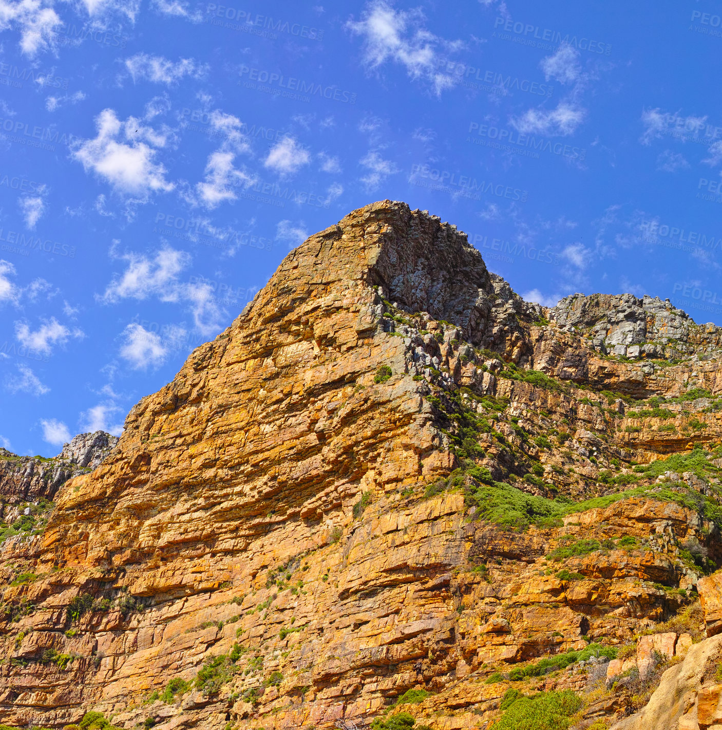 Buy stock photo Low angle view of a mountain peak in South Africa. Scenic landscape of a remote hiking location on Lions Head in Cape Town during a sunny day. Travelling and exploring nature through adventure