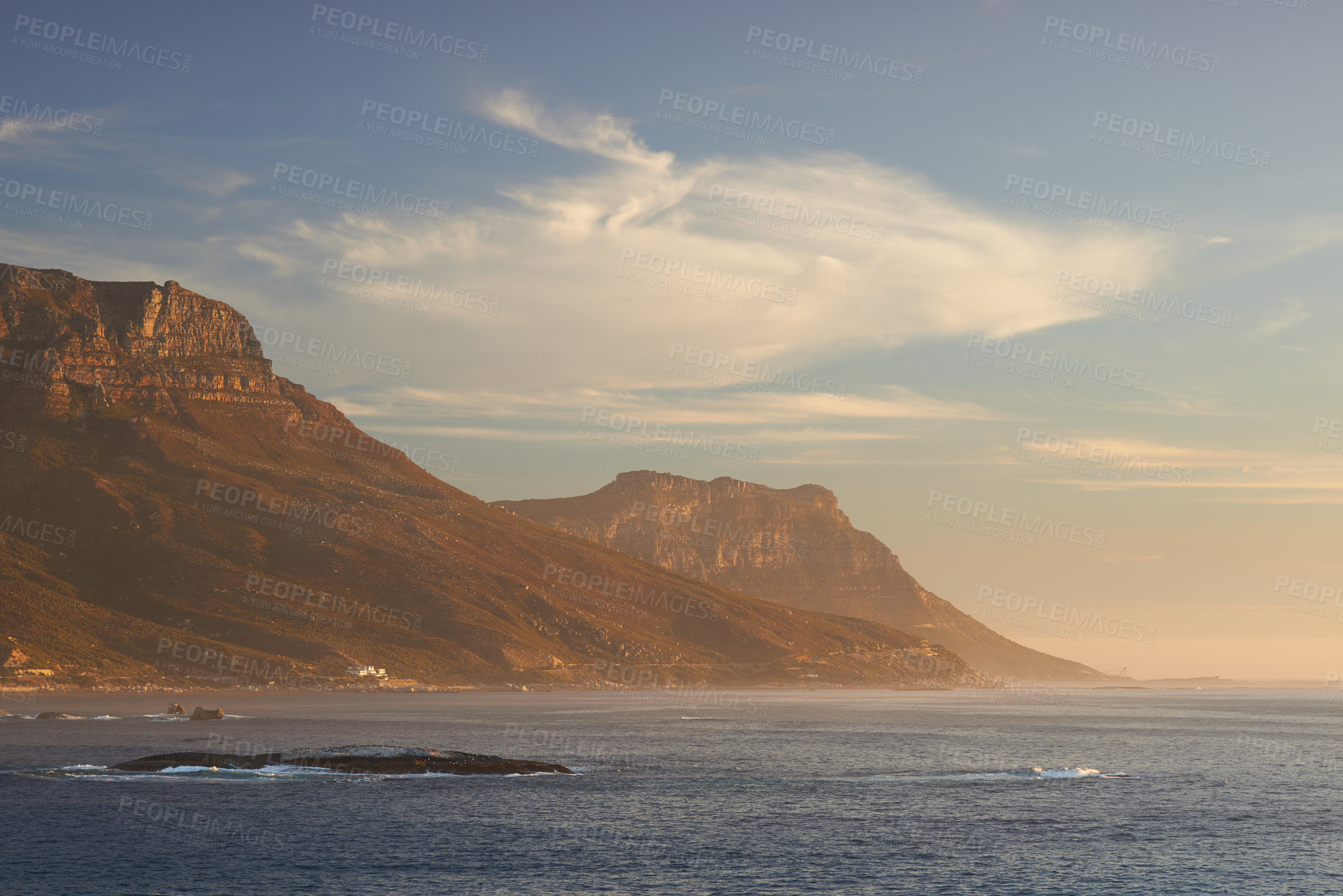 Buy stock photo Seascape, landscape, scenic view of Hout Bay in Cape Town, South Africa at sunset. Blue ocean and sea with mountains in the evening with copyspace. Travel abroad and overseas for holiday and vacation